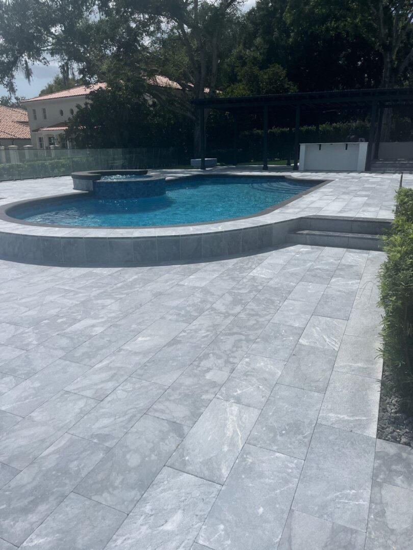 Decorative grey brick pavers in the Braun pool deck