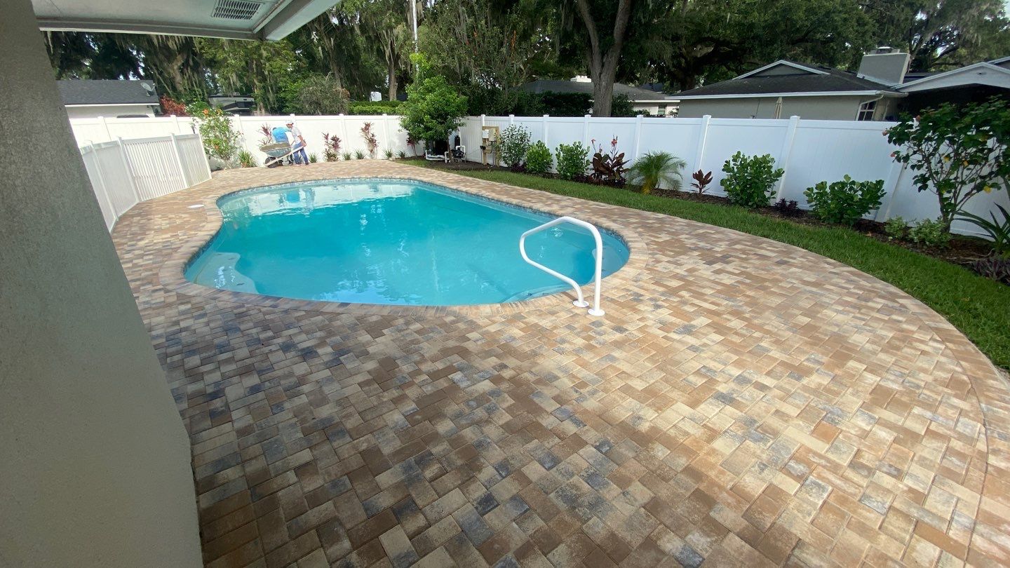 Concrete Seamen's pool deck with decorative brick pavers